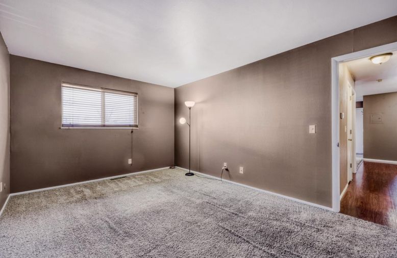 Older living room inside a Colorado property purchased as-is